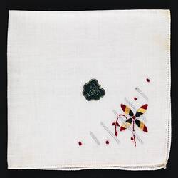 Folded handkerchief with Embroidered Flower.