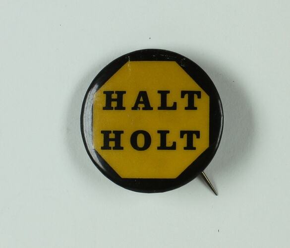 Round yellow badge with black border and text.