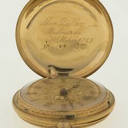 Ladies gold pocket watch in gold case. Cursive inscription inside case lid.