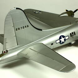 Silver model aeroplane. Detail back tail.