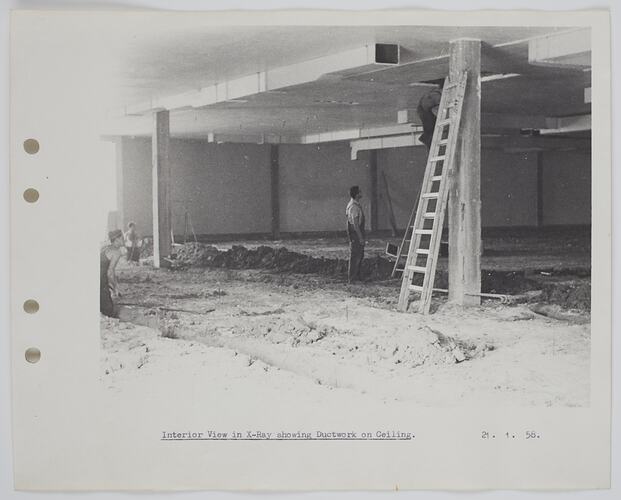 Workers inside a building under construction.