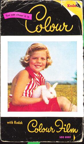 Cover page with girl and rabbit, field in background.