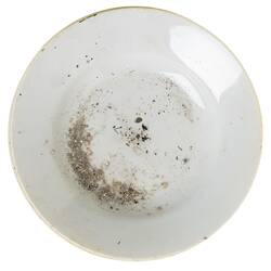 Stained dusty white soup bowl.