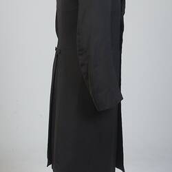 Gentleman's black cotton frock coat, profile.