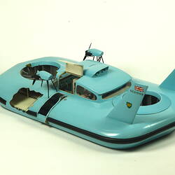 Light blue hovercraft with two propellers, three quarter view.