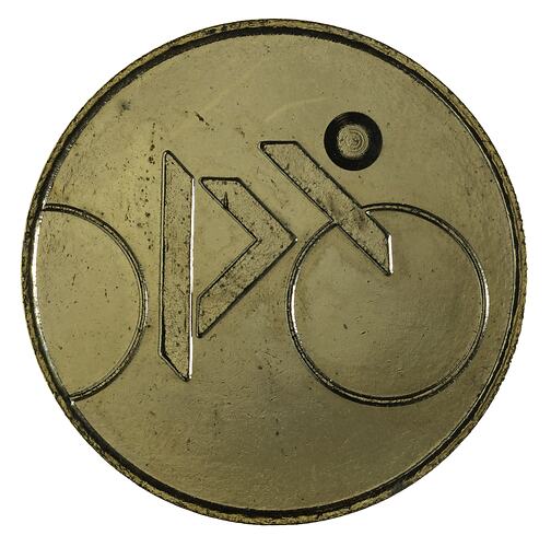 Round gilt medal with cycling logo from Brisbane Commonwealth Games.