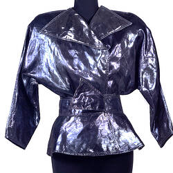 Blue metallic belted jacket on mannequin.