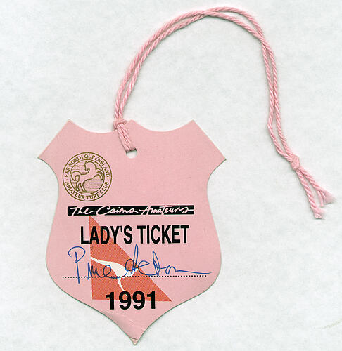 Pink shield shaped ticket with string.