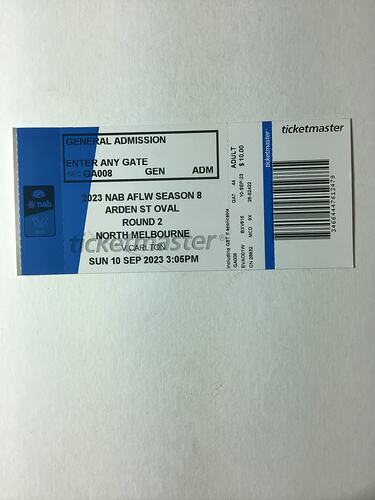 White and blue ticket with black printed text and barcode.
