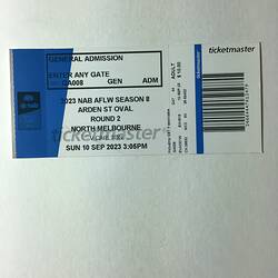 White and blue ticket with black printed text and barcode.