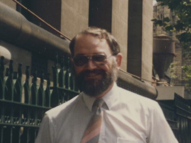 man with beard wearing white shirt