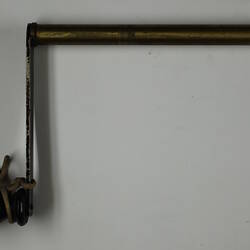 Metal hand crank with wooden handle.