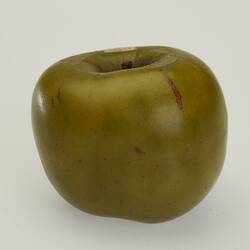 Wax model of green apple.