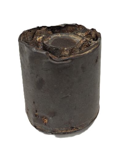 Side view of metal jam tin grenade.