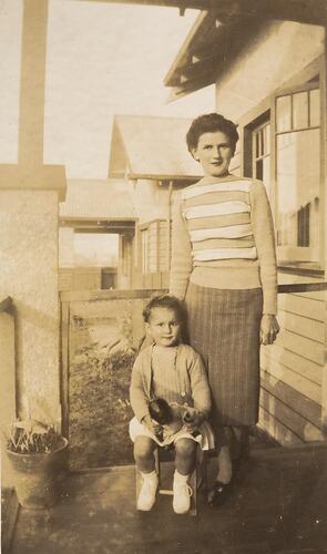 Digital Photograph - 'Not more snaps  Mummy\x{2026}', Mother & Daughter on Front Verandah, Preston East, 1946