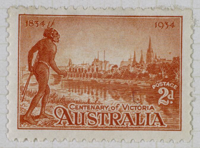 Orange printed stamp of man looking across river to cityscape.