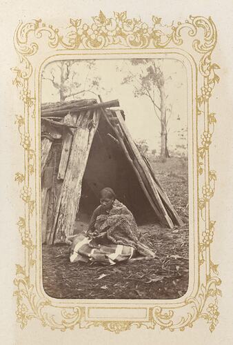 A woman preparing possum skins, Victoria, 1872