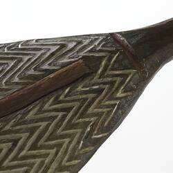 Detail of pointed end of a wooden shield.