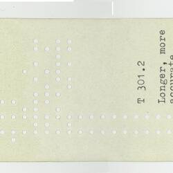 Paper tape with typed text and punched holes.