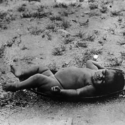 Arrente baby lying on arethape unkumba