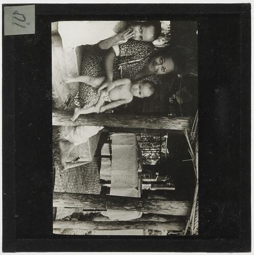 Lantern Slide - Woman with Two Children in Hut, Fiji, circa 1920s