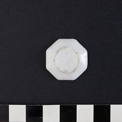 Base of white, octagonal, doll's plate