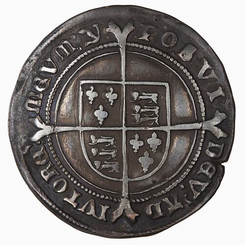 Coin with quartered shield on a cross. Text around.
