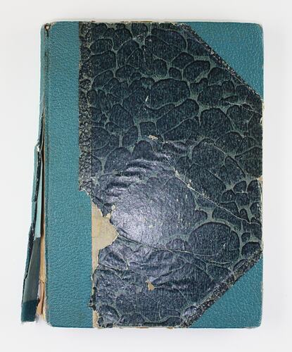 Green patterned book cover with binding on spine