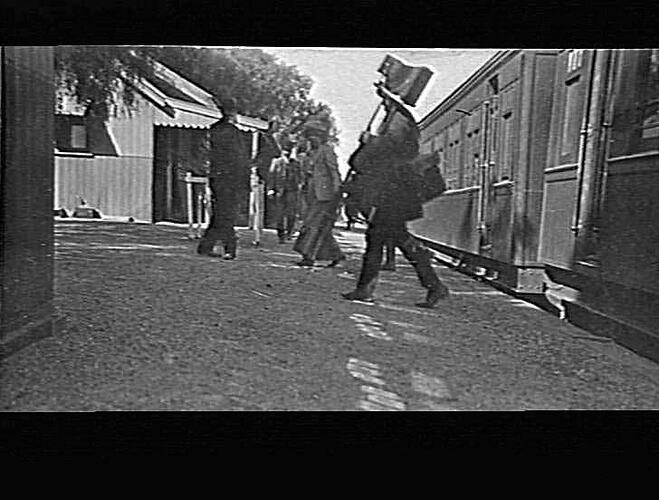 MERRIGUM - RAILWAY STATION - J P CAMPBELL WITH CAMERA
