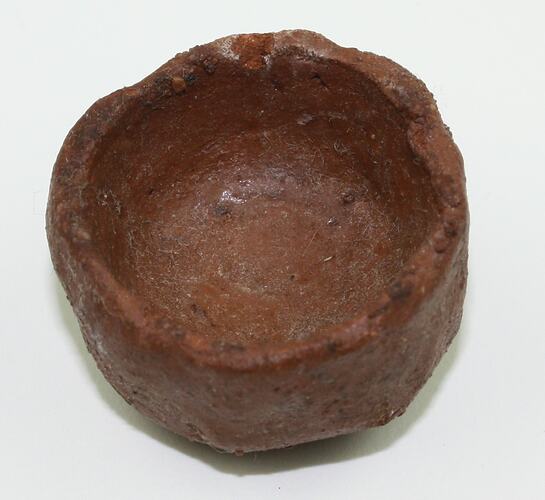 Toy bowl made from clay, viewed from above.