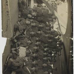 Group portrait of Servicemen on board a ship.