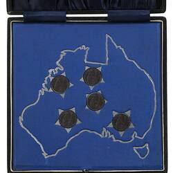 Black hinged case with blue textile lining. The inner base is blue cloth with silver map and stars.