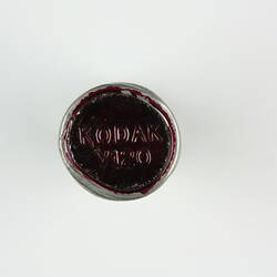 Embossed wax seal on film canister.
