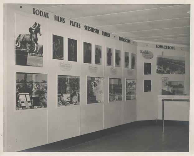 Wall of product displays and photographs.
