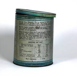 Cylindrical metal tin, blue and silver, with black text