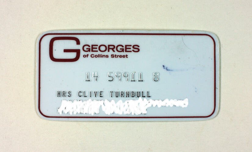 Front of store card, white with red border, address obscured