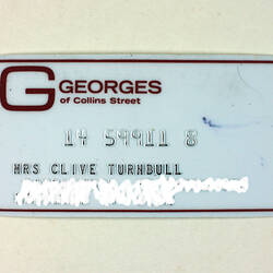 Front of store card, white with red border, address obscured