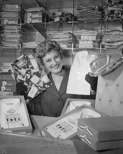 Negative - Woman Displaying Shirts, Coltons General Drapery Store ...