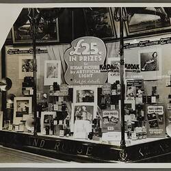 Shopfront display advertising Kodak photography competition.