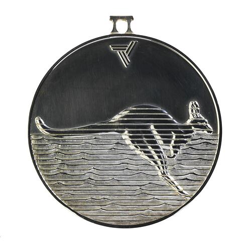 Tarnished silver round medal with kangaroo profile set against wavy horizontal lines.