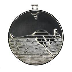 Tarnished silver round medal with kangaroo profile set against wavy horizontal lines.