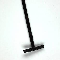 Toy rake lying down.
