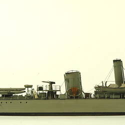 Grey coloured naval ship, facing right.