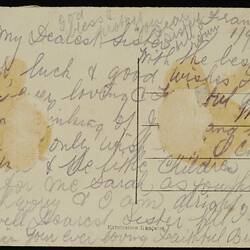Postcard with faded handwritten text.