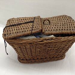 Twin lid woven sewing basket.