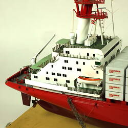 Container ship with red hull, detail of rear deck.