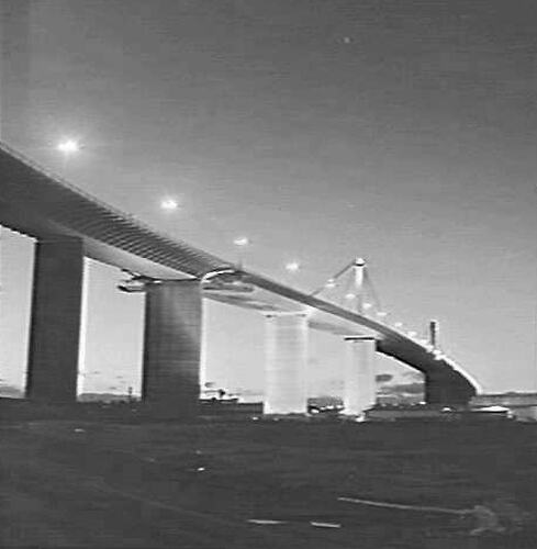 Bridge illuminated at night.