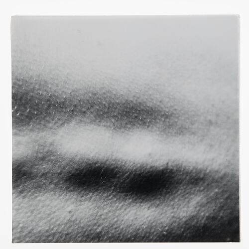 White canvas with black and grey shading. Darker towards bottom edge.
