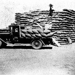 Negative - Stacking Wheat Sacks from Motor Truck at Thurla Railway Station, Millewa District, Victoria, circa 1930