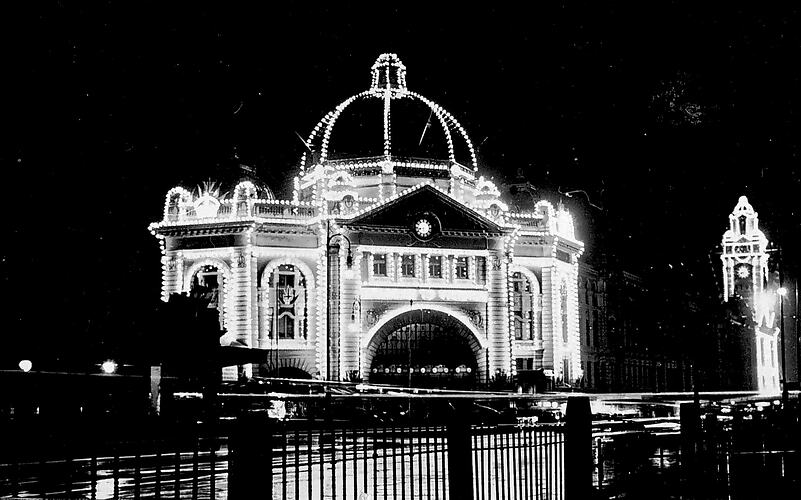 Flinders St Station illuminated for Prince of Wales visit, 1920.